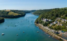 Aerial view of Golant, the river Fowey and the Cormorant property development